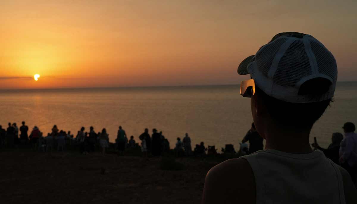 People view a partial solar eclipse on Sidi Mechreg beach, in Bizerte, Tunisia, August 12, 2026.— Reuters