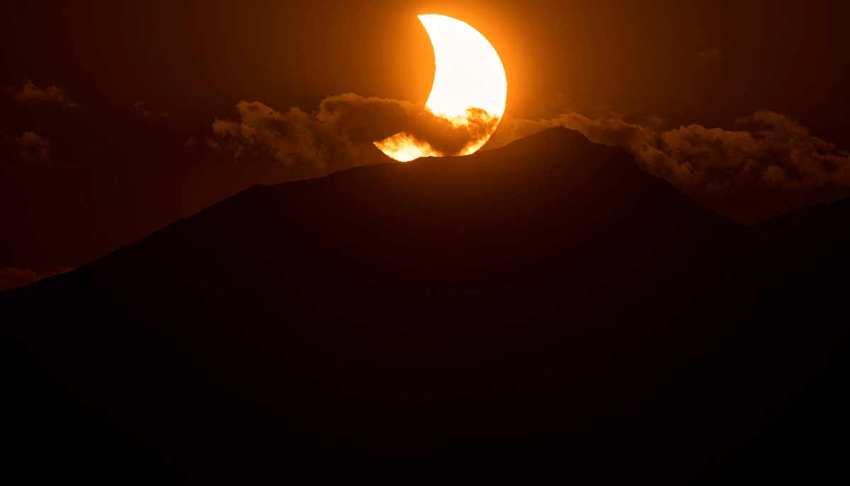 The moon partially covers the sun during a solar eclipse over mountains near the northern Spanish town of Reinosa, August 12, 2026.— Reuters