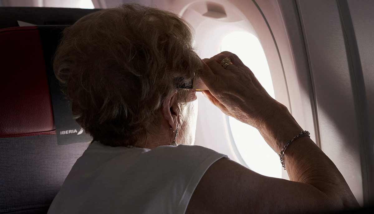 A passenger looks out the window during a special Iberia flight on the day of a total solar eclipse, over the skies of Spain, August 12, 2026.