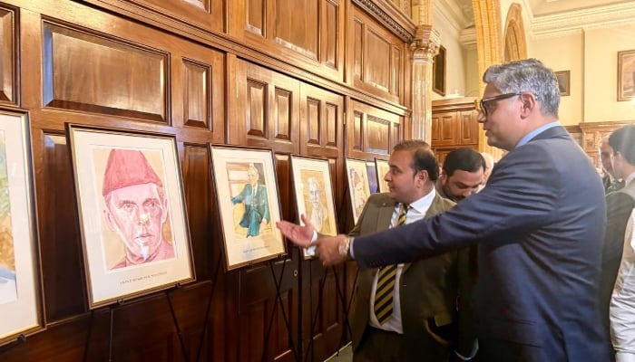 High Commissioner Tipu Usman views paintings at an exhibition celebrating the life, vision and enduring legacy of Quaid-e-Azam Muhammad Ali Jinnah at the National Liberal Club in London on August 13, 2026. — Reporter