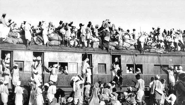 An archival image from the 1947 Partition shows people travelling by train amid the mass migration between India and Pakistan. —The News/File