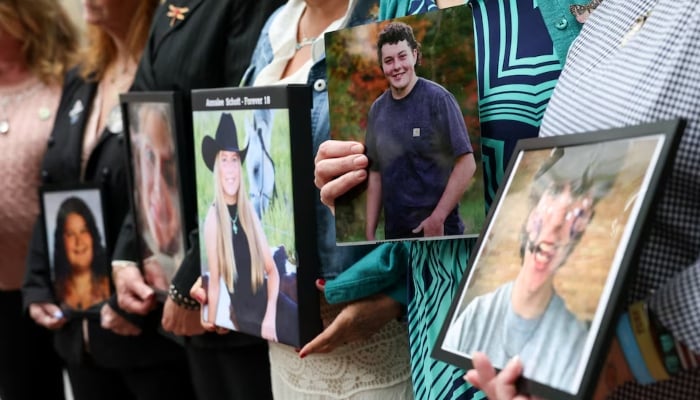 People hold pictures of children and young adults, as parents of children whose deaths were related to social media use hold a press conference, as Meta faces a landmark trial in federal court, in Oakland, California, US, August 18, 2026. — Reuters