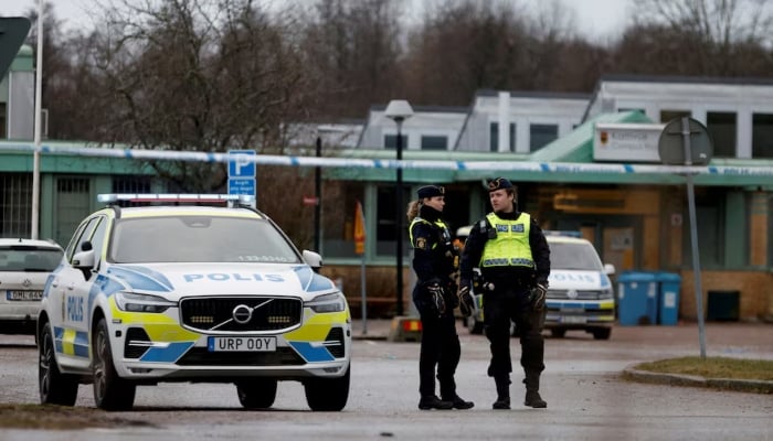 Police officers stand near the Risbergska school, following a deadly shooting attack at the adult education center in Orebro, Sweden, February 5, 2025. — Reuters