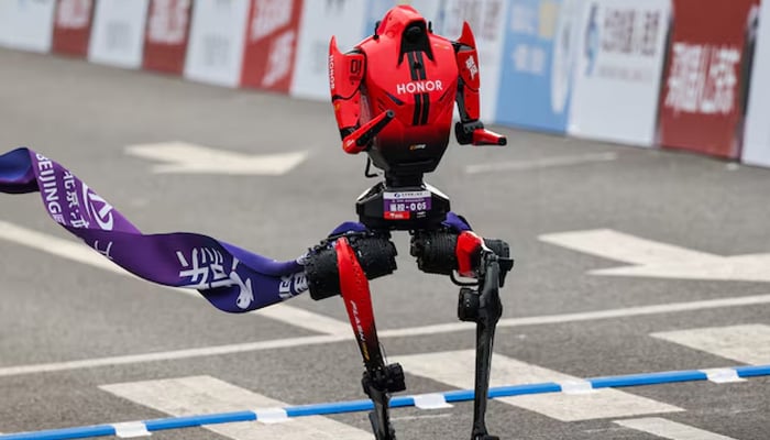 A Lightning humanoid robot by Honor crosses the finish line of the second Beijing E-Town Half Marathon and Humanoid Robot Half Marathon in Beijing, China April 19, 2026. — Reuters