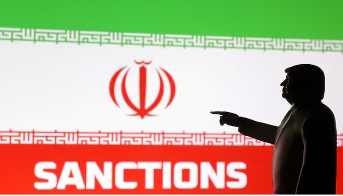 A 3D-printed miniature model depicting US President Donald Trump, Iran flag, and the word Sanctions in this illustration, created on April 17, 2025. — Reuters