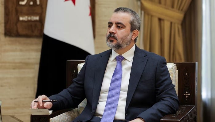 Syrian Foreign Minister Asaad al-Shaibani looks on during an interview with Reuters in Damascus, Syria, August 22, 2026. — Reuters