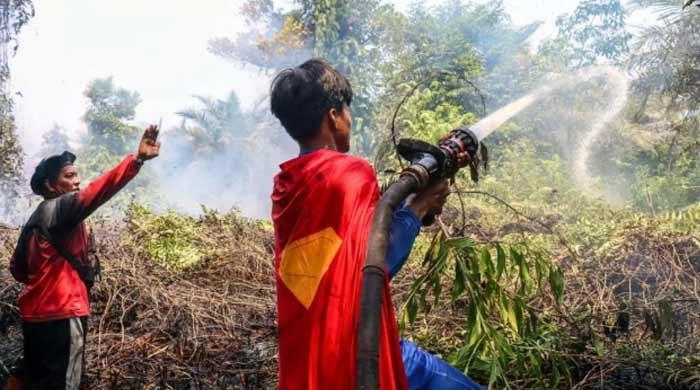 'Keep up spirit': Indonesian teenage 'Superman' joins wildfire fight