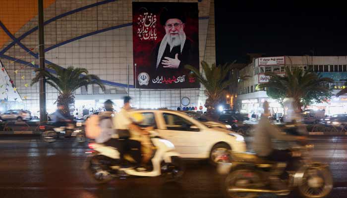 eople drive past a billboard depicting Irans late Supreme Leader Ayatollah Ali Khamenei, on a street in Tehran, Iran, August 23, 2026.— Reuters