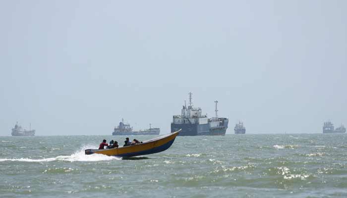 Vessels in the Strait of Hormuz are visible near the beach of Bandar Abbas, Iran, August 25, 2026.— Reuters