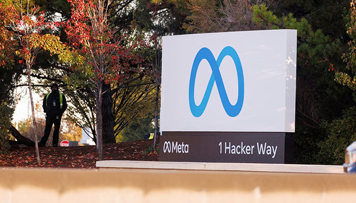 A security guard stands watch by the Meta sign outside the headquarters of Facebook parent company Meta Platforms Inc in Mountain View, California, US November 9, 2022. — Reuters