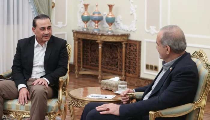 Chief of Defence Forces (CDF) and Chief of Army Staff (COAS) Field Marshal Syed Asim Munir (left) speaks during a meeting with Irans President Masoud Pezeshkian in Tehran, Iran, August 25, 2026. — X/@drpezeshkian2