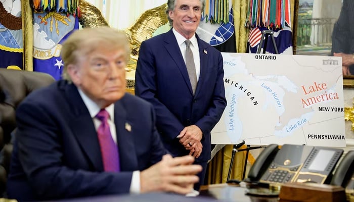 US President Donald Trump sits next to a map with Lake America written on it as he attends an event to sign an executive order at the Oval Office of the White House in Washington, DC, US, August 27, 2026.— Reuters
