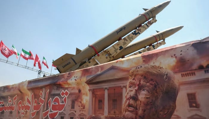 A banner with a picture of U.S. President Donald Trump next to an Iranian missile system at Azadi Square in Tehran, Iran, July 30, 2026.— Reuters