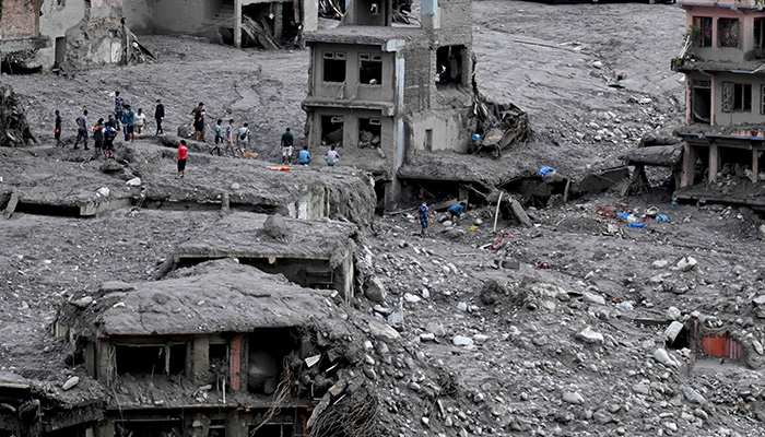 People scout for usable materials from debris after flash floods at Trishuli Center in Nepals Nuwakot district on September 1, 2026. — AFP