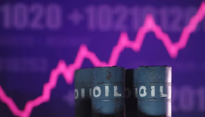 A rising stock graph and 3D-printed oil barrels miniature are seen in this illustration taken on June 23, 2025. — Reuters