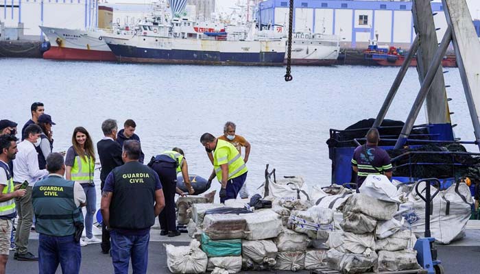 Police officers discharge drugs from the fishing boat AKT-1 seized south of the Canary Islands in the port of Las Palmas, in the island of Gran Canaria, Spain, April 16, 2022. — Reuters