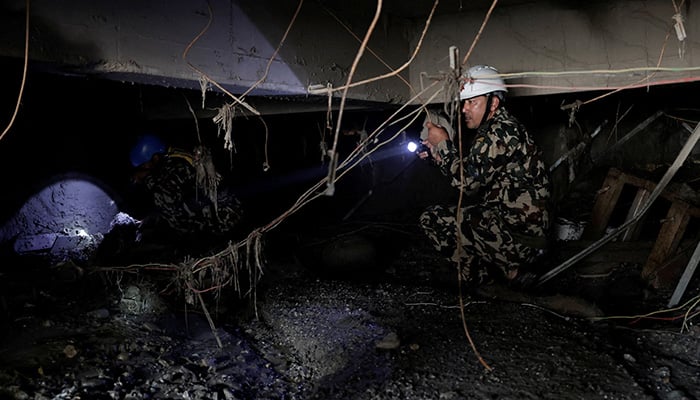Members of the Nepal Army search for survivors and work to retrieve bodies through the remains of a building near the entrance of a tunnel at the Upper Trishuli 3A Hydropower Station, following the deadly flash floods and mudslides, in Rasuwa, Nepal, September 3, 2026. — Reuters