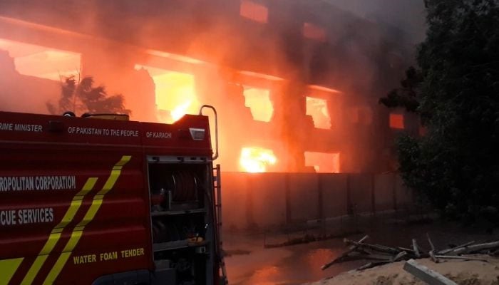 Rescue official making efforts to douse the blaze at a factory in Karachi’s Landhi Export Processing Zone on September 7, 2026. — YouTube/Geo News/screengrab