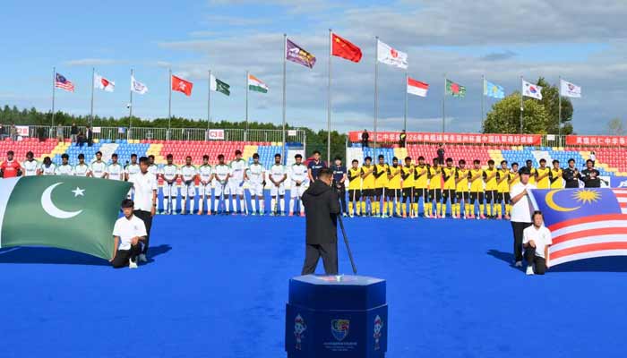 Pakistan and Malaysian hockey players stand in line for the national anthems ahead of their Men’s Junior Asia Cup 2026 match in Moqi, China, on September 9, 2026. - Facebook/Asian Hockey Federation