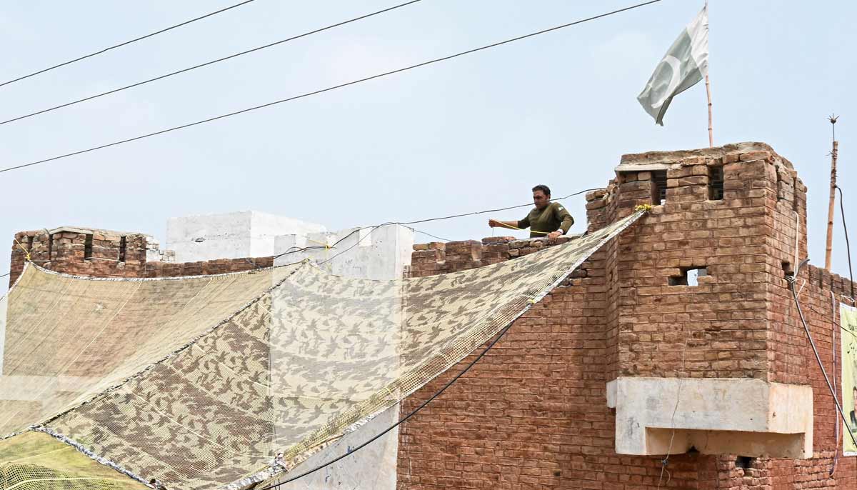 A security personnel fortifying a police post with Ukraine-style mesh barriers, as a new line of defence against militant drone and aerial attacks at Bara in Khyber Pakhtunkhwa. — AFP