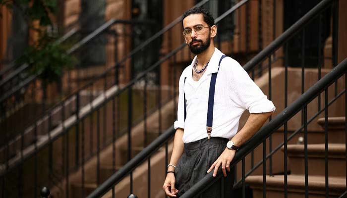 Asad Dandia conducts a guided tour about Malcolm X in the Harlem area of New York on August 22, 2026.— AFP