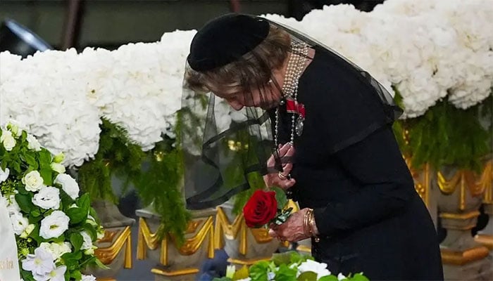 Queen Sonjas final red rose for King Harald leaves Oslo Cathedral in tears