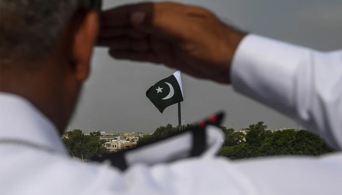 A Pakistan Navy officer salutes at the mausoleum of founder Muhammad Ali Jinnah during the Independence Day celebrations in Karachi on August 14, 2020. — AFP