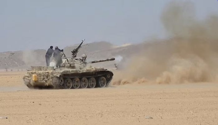 Members of the Saudi-backed Yemeni government forces fire a tank during what they say to be clashes with Yemens Iran-aligned Houthis in a location given as near Al-Hazm, Yemen, in this screen grab obtained from a handout video released September 9, 2026.— Reuters