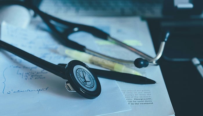 A representational photo shows a doctors prescription alongside a stethoscope and pen. — Unsplash